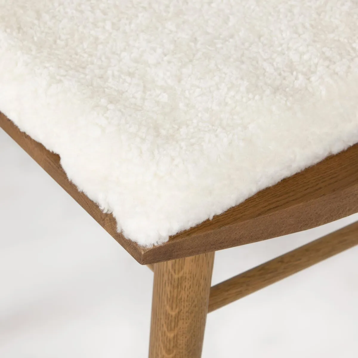 Four Hands Lewis Windsor Chair in Sandy Oak with Shorn Sheepskin Cushion